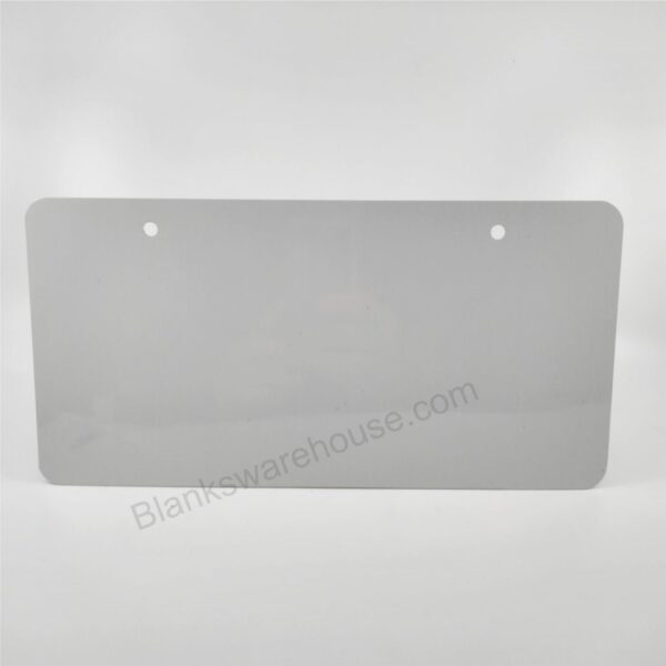 A license plate shaped aluminum plate with two holes
