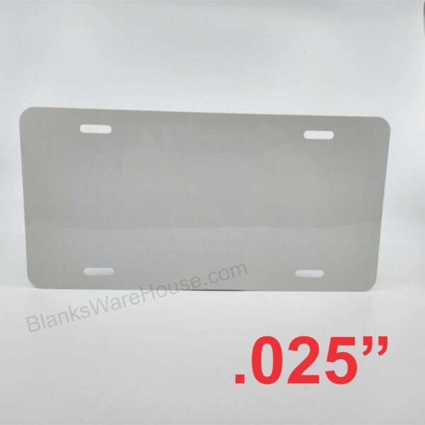 A license plate shaped aluminum plate with two small holes
