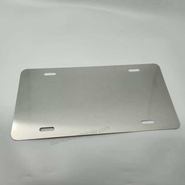 A license plate shaped aluminum plate in silver color