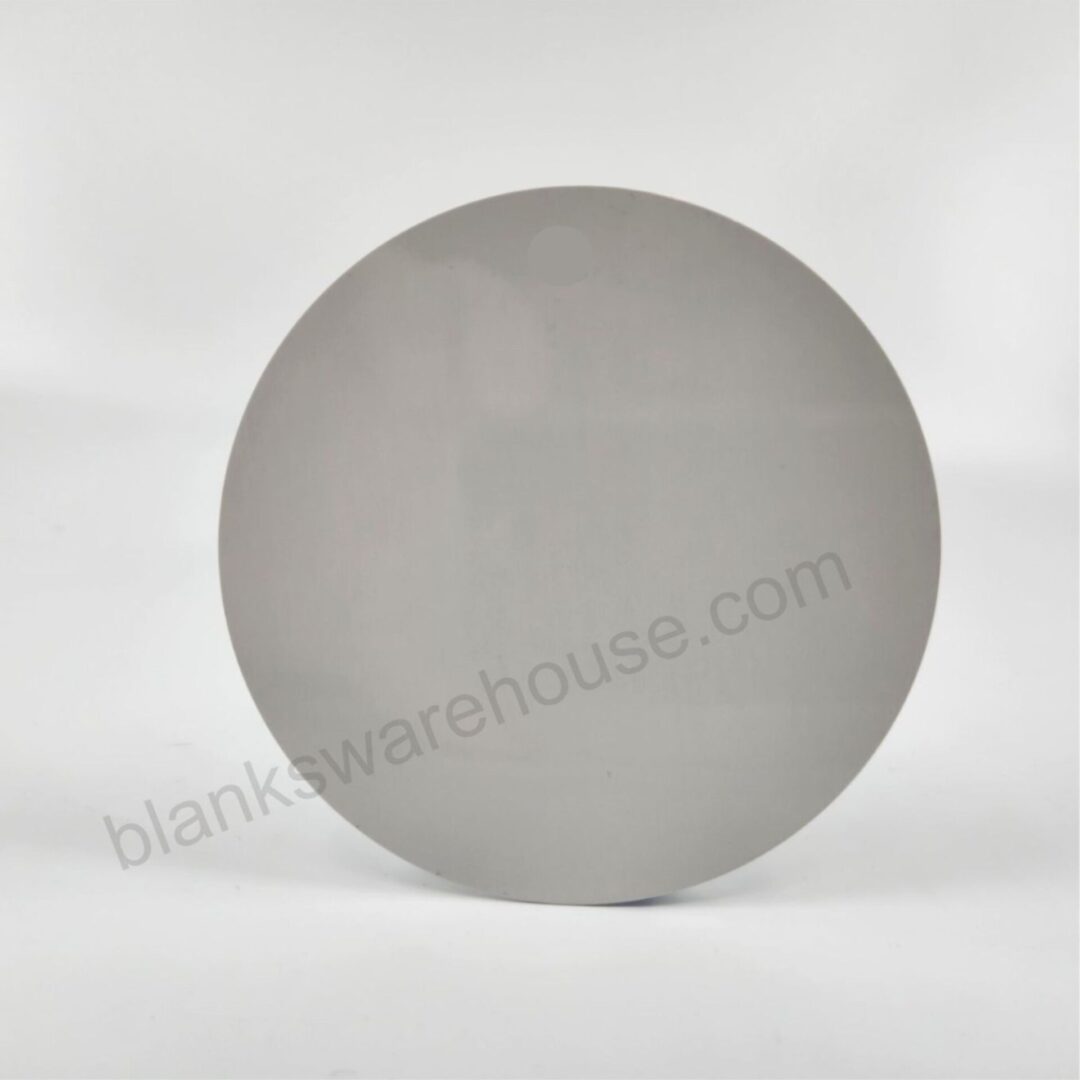 A circle shaped aluminum plate with one hole