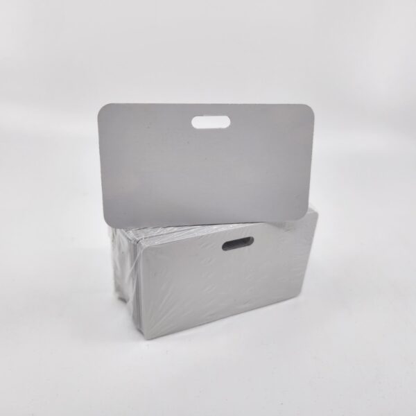 A packet of white panels with a cutout at the top kept on a white background